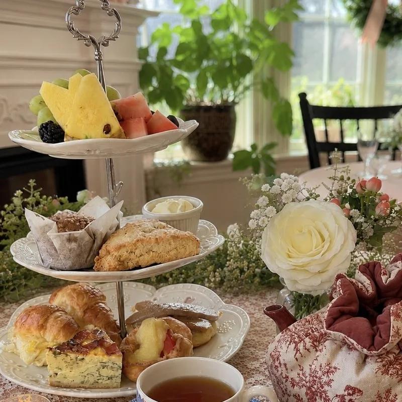 A three-tier stand of scones, a muffin, croissants and quiche for Elevenses afternoon tea