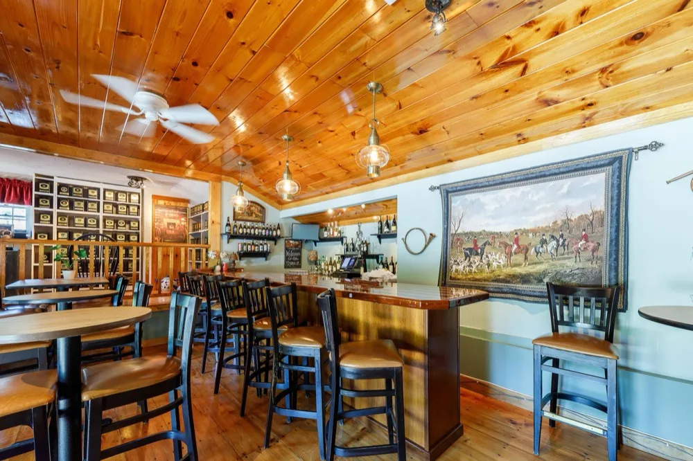The tea room bar and a wall of shelves lined with jars of loose leaf tea